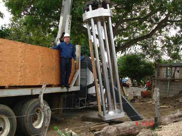 Alejandro with www.interviv.com standing beside 2lBin's BIGGEST Tapping Machine.